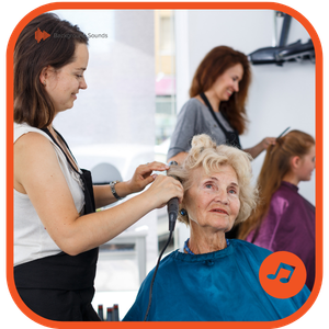 Hair salon staff motivated and engaged during a busy working day with background music playing